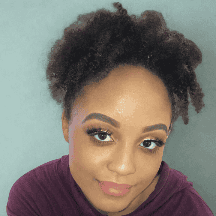 headshot of a woman on an aqua background