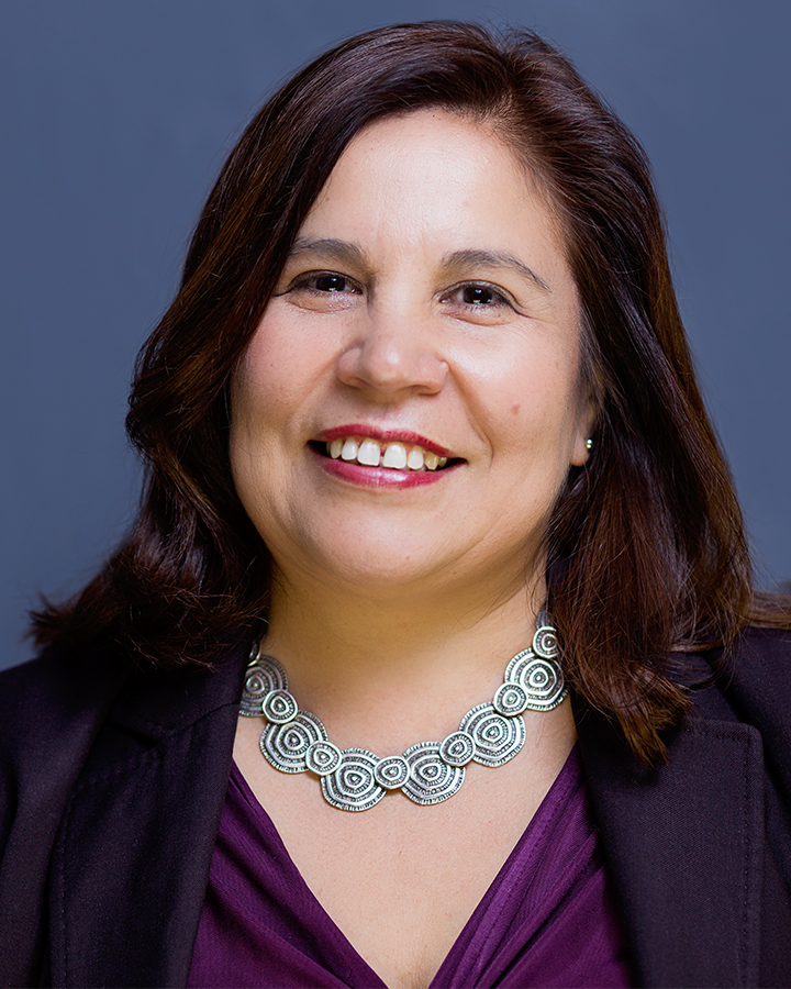 Angélica Salas Portrait with a blue background