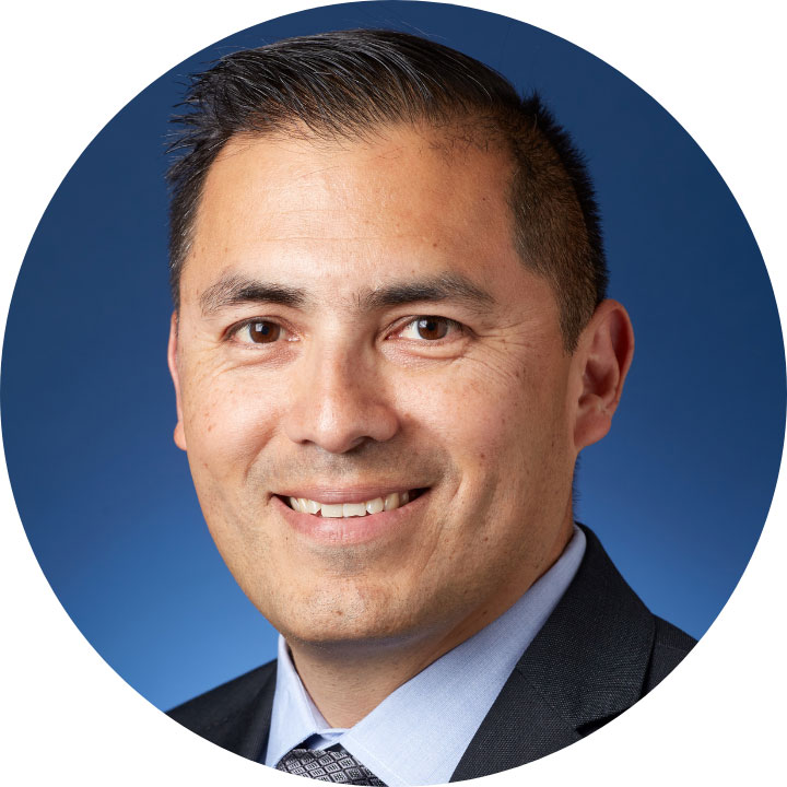 circular headshot of LMU SOE staff member Ramiro Euyoque