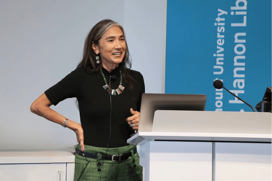woman standing in front of a lectern