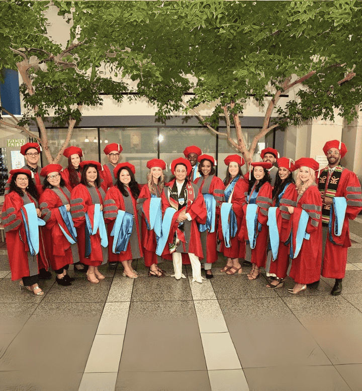 group of doctoral students wearing regalia for commencement