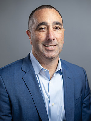 Blake Silvers Portrait, Man in blue suit in front of a grey background