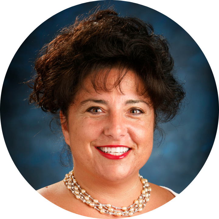 circular headshot of a woman on a blue background