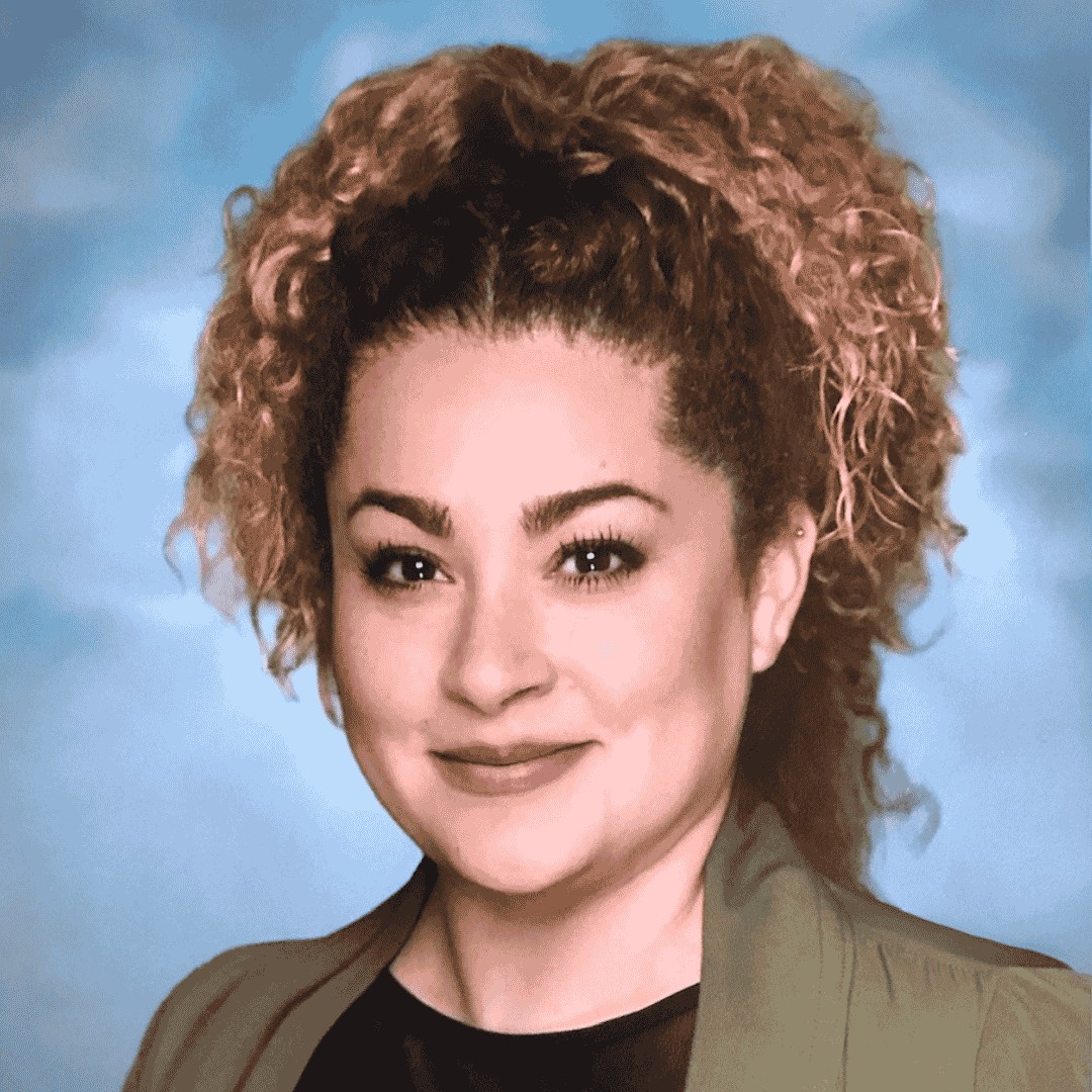 headshot of a woman on a blue background
