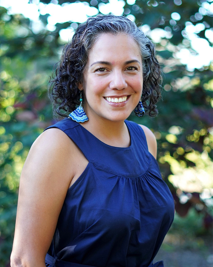 Margarita Luna Portrait Outside with a lush green background