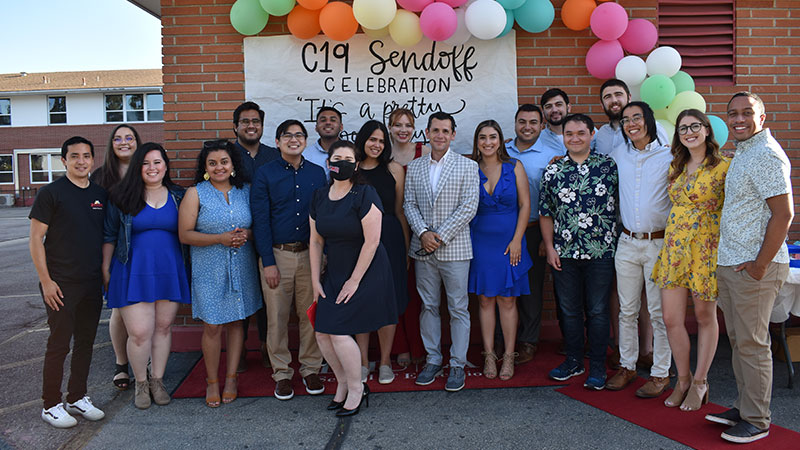 graduate students and faculty and staff of LMU PLACE Corps standing at a celebration