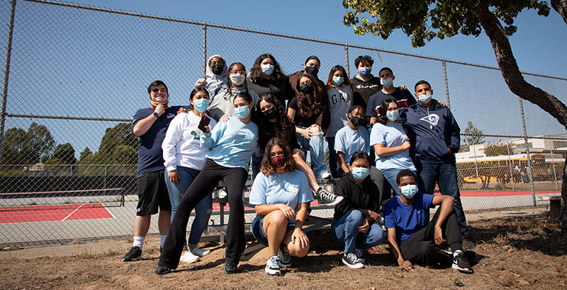 image of high school kids on a school campus outdoors