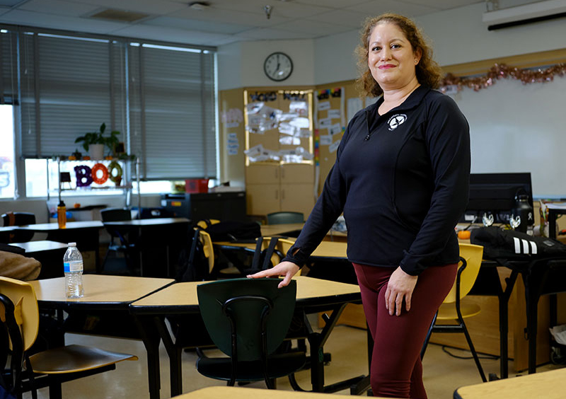 photo of woman standing in classroom