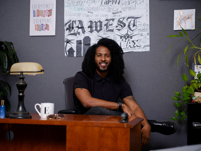 photo of man sitting at desk in office