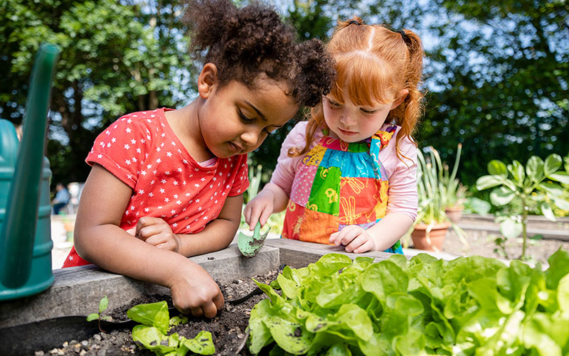 young kids gardening